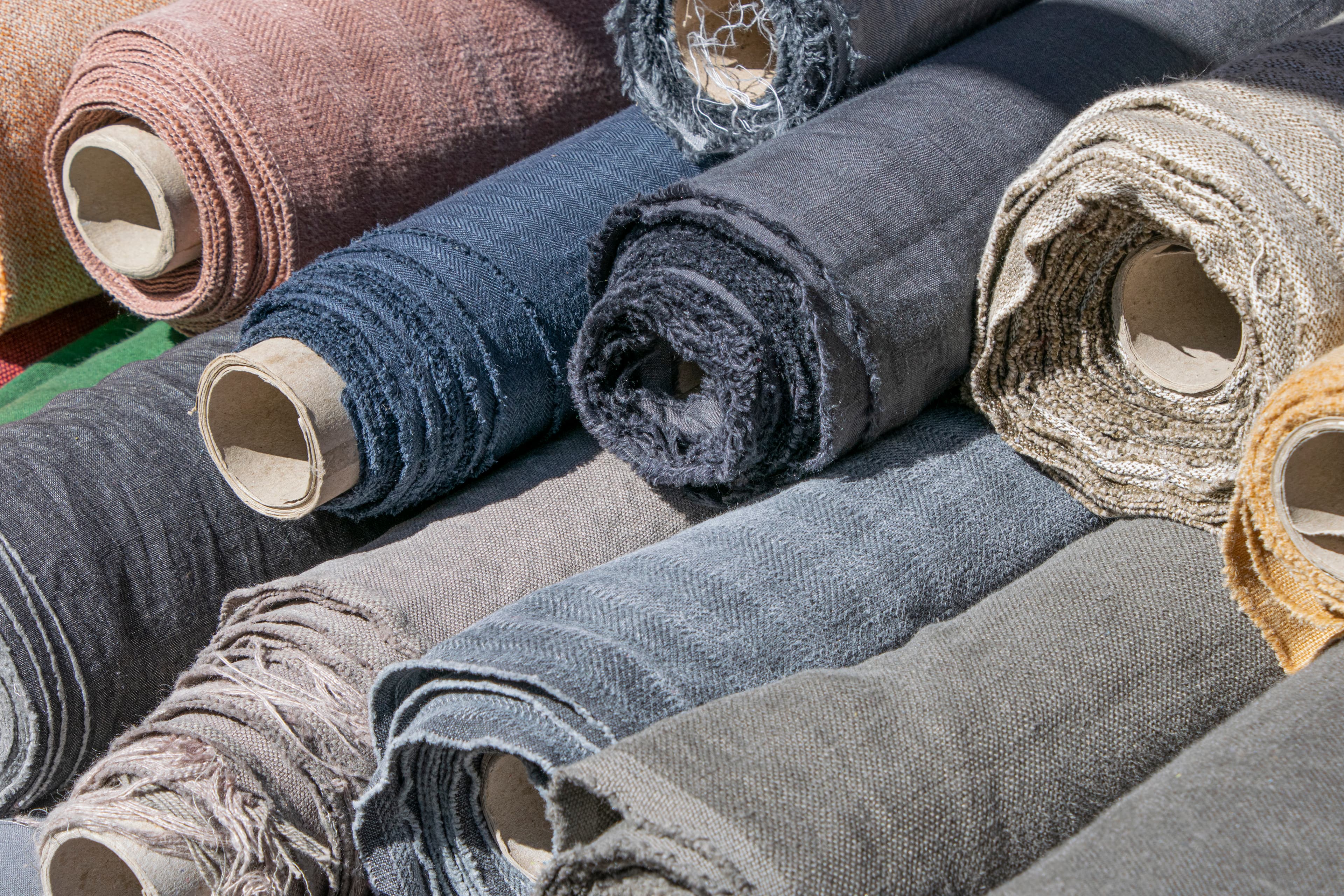 Rolls of linen and canvas on a market stall